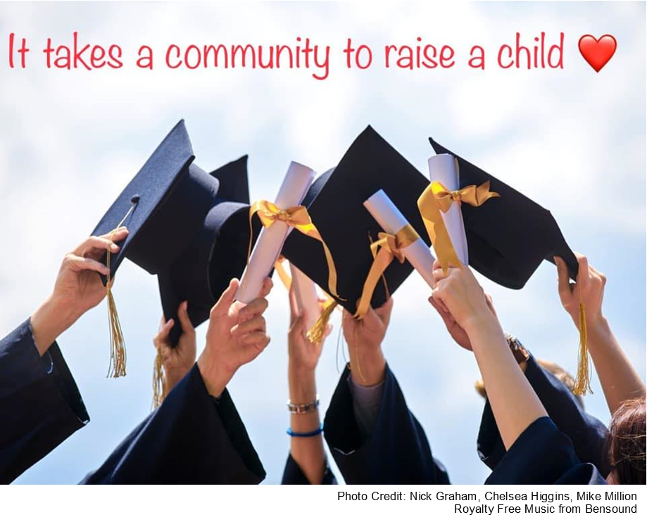 students holding up graduation caps with "It takes a community to raise a child"
